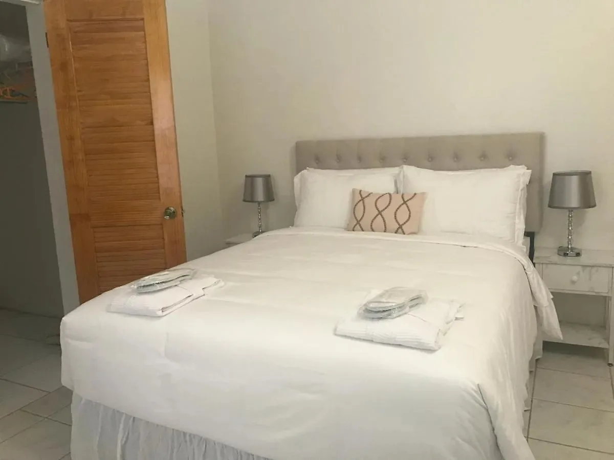 Upstairs Ensuite guest room with queen bed at Compassionate Touch B&B
