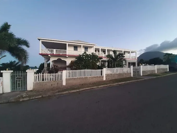 Compassionate Touch Spa & B&B building exterior at dusk